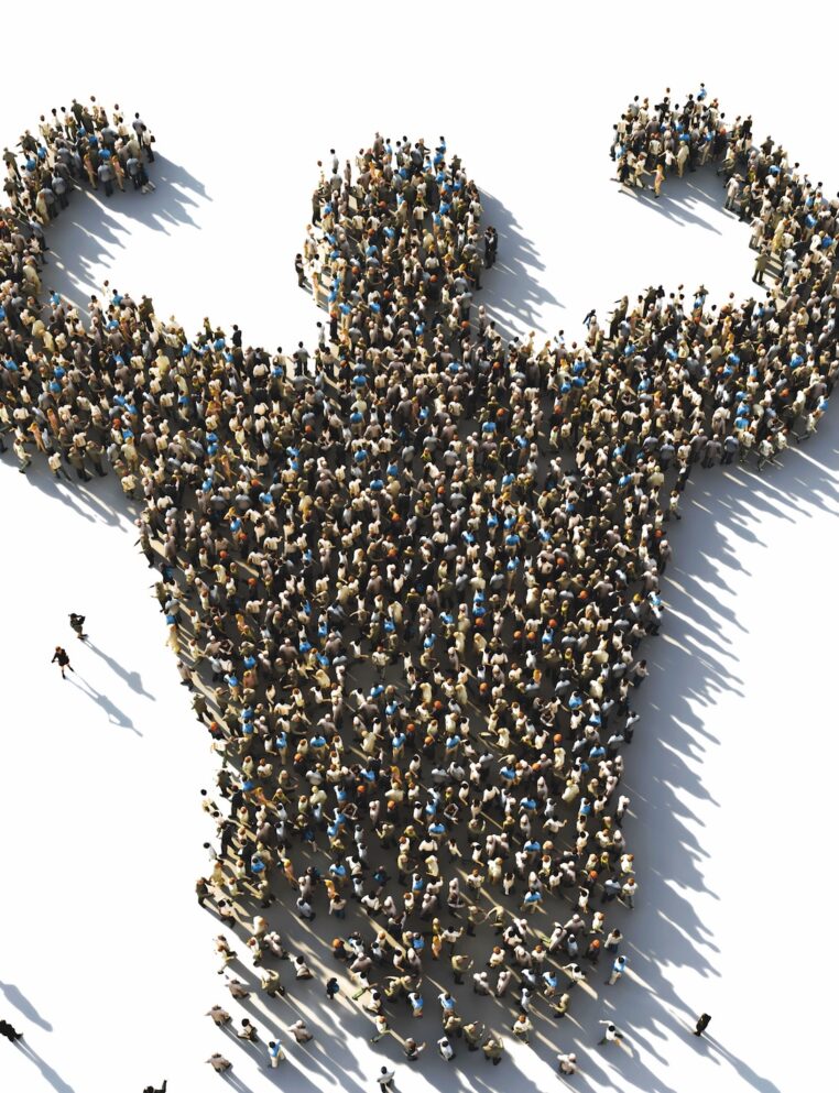 Large crowd of people gathered in formation shaped like a person flexing biceps, casting long shadows on a white background.