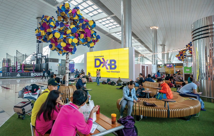 A seating area at Terminal 3 offers activities and playful decor with comfortable tables and seating.