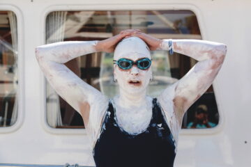 Kim Chambers, a champion open-water swimmer, covered in lanolin and zinc before a 48-hour swim attempt in Sacramento, Calif.