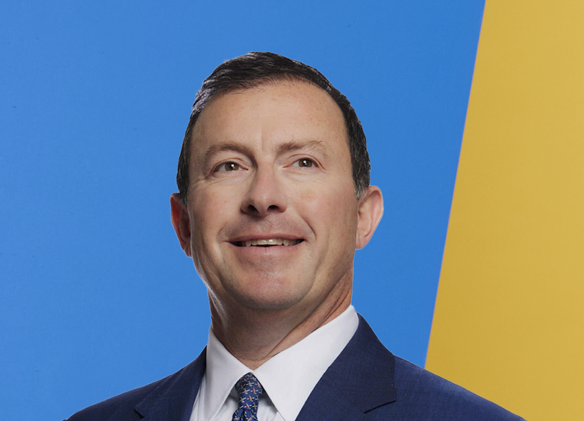 Headshot photo of Steve Winoker, CIRO of PayPal, with a blue and yellow background