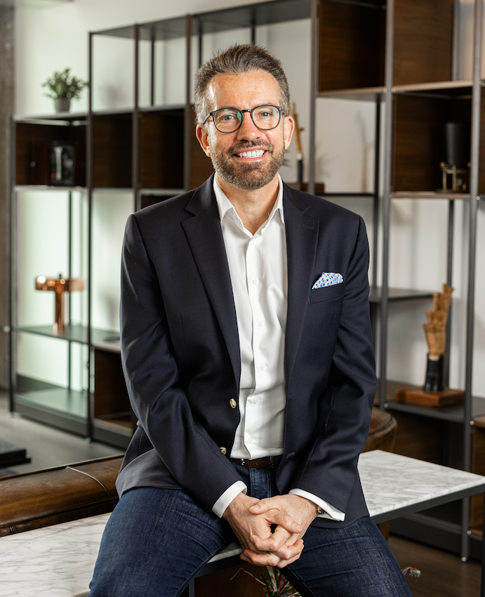Nick Jeffery, CEO of Frontier Communications, seated in an office.