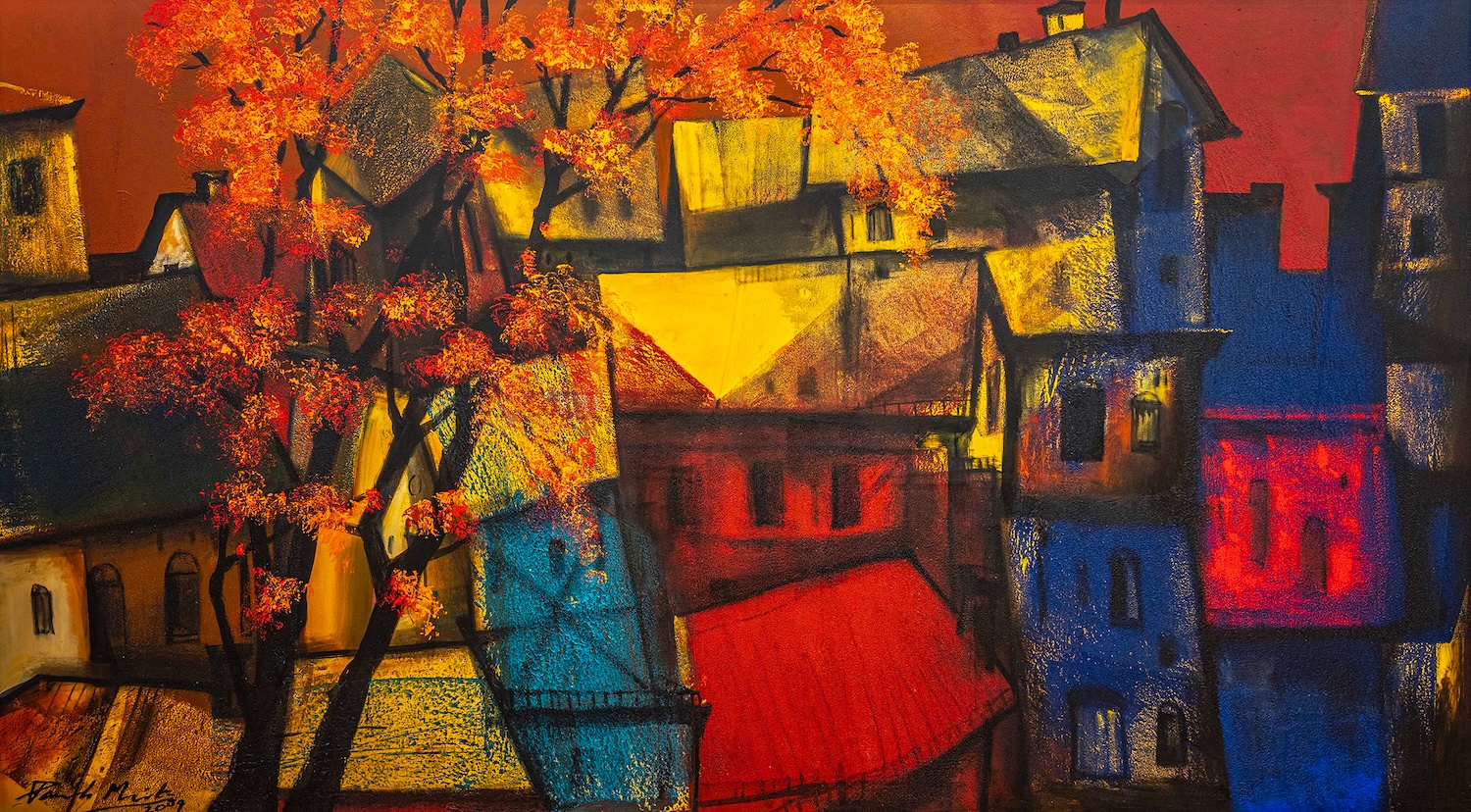 A photograph of Indian artist Paresh Maity’s painting “Gulmohar III” a vibrant abstract painting of houses and trees in bright yellows, reds and blues.
