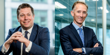 two headshots side by side of men in navy suits standing in front of glass office walls